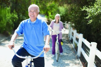 Getty Images
Smiling older couple riding bicycles