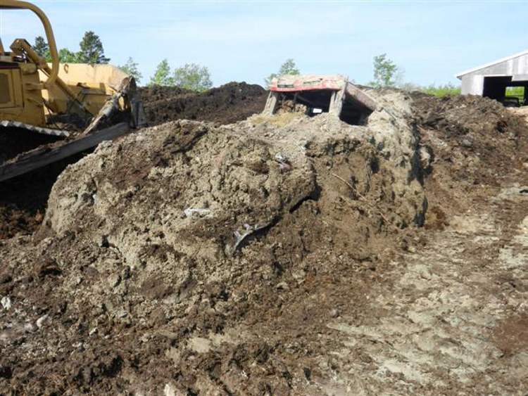 SUBMITTED PHOTO
An RCMP photo of the stolen tractor, found in a 15-foot-high manure pile.