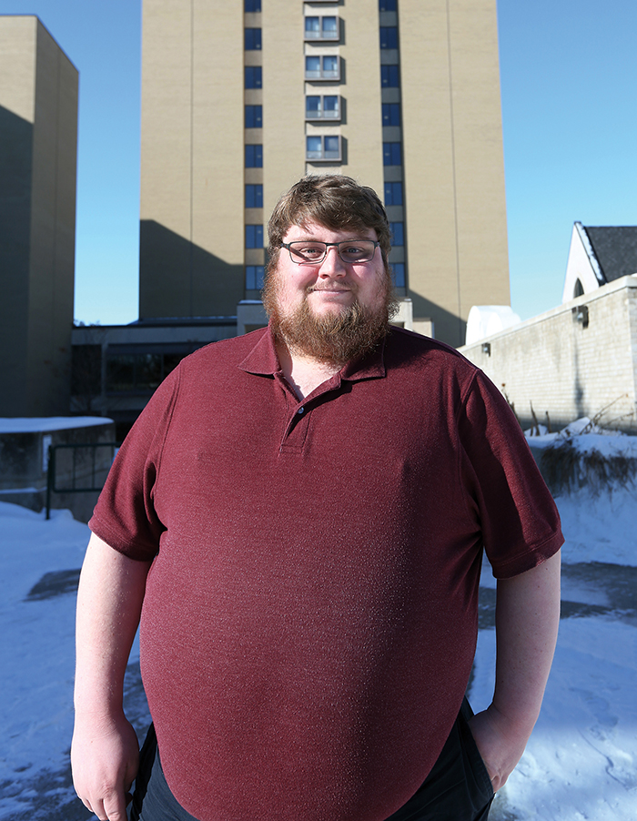 President of the Brandon University Students' Union Nick Brown stands outside of his long-time home McMaster Hall. (Michael Lee/The Brandon Sun)