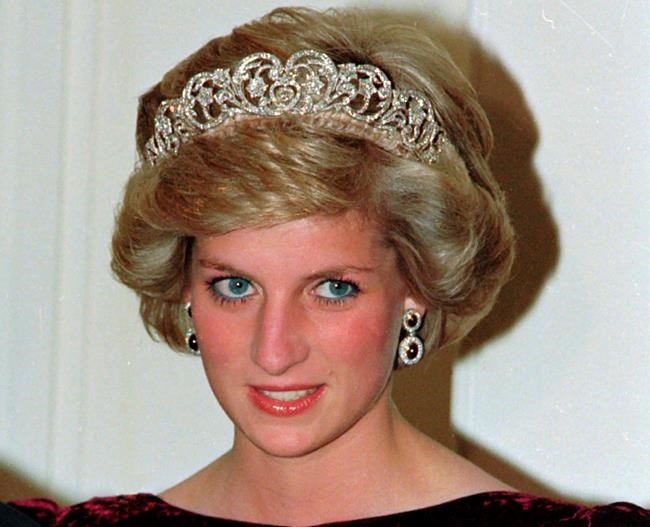 FILE - In this file photo dated Nov. 7, 1985, Britain's Princess Diana wears the Spencer tiara as she and Prince Charles attend state dinner at Government House in Adelaide, Austraila. The BBC’s board of directors has announced Wednesday Nov. 18, 2020, the appointment of a retired senior judge to lead an independent investigation into the circumstances around a controversial 1995 TV interview with Princess Diana. (AP Photo/Jim Bourdier, FILE)