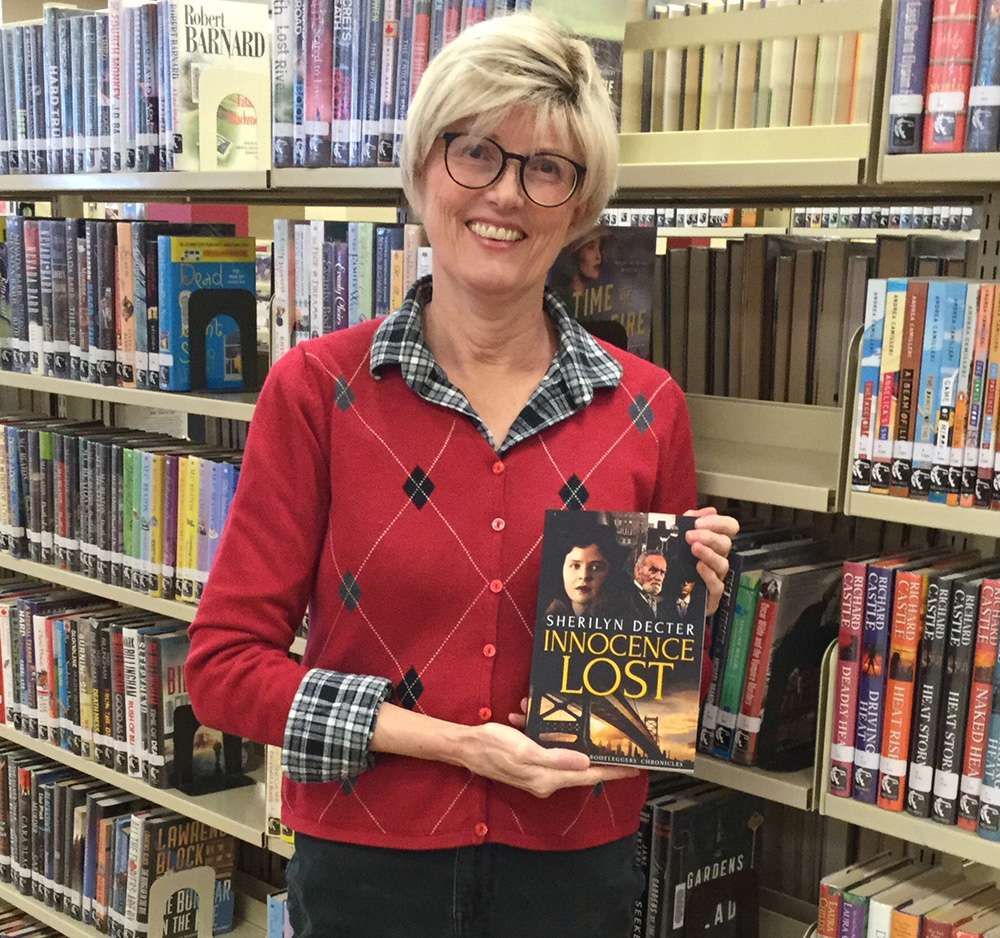 Former Brandon mayor Shari Decter Hirst poses with a copy of her book 