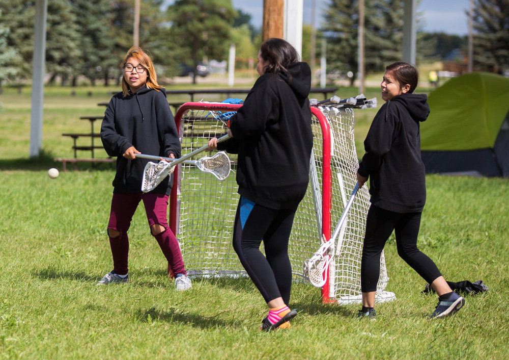 Elise McArthur, 11, plays lacrosse at the Dakota Tiwahe Services and Jordan's Principal hosted Sioux Valley Culture Camp on Aug. 27.  (Chelsea Kemp/The Brandon Sun)