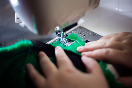 Onix Collette, local fur suit designer, works on her latest fur suit design on Nov. 14.