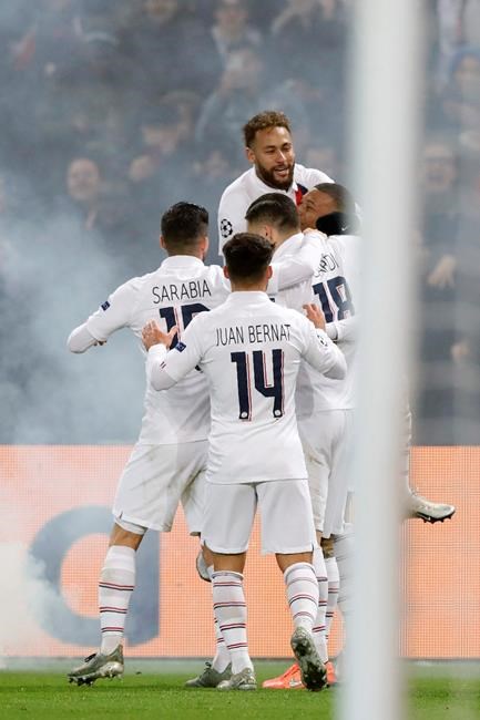 PSG's Kylian Mbappe, right, celebrates after scoring his side's fourth goal during the Champions League group A soccer match between PSG and Galatasaray at the Parc des Princes stadium in Paris, Wednesday, Dec. 11, 2019. (AP Photo/Christophe Ena)