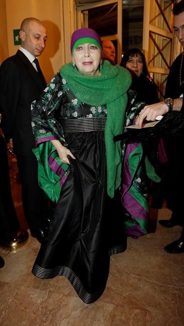 FILE - In this photo taken on Dec. 7, 2012, Italian actress Valentina Cortese arrives at the Milan La Scala theater, Italy. The renown actress, who worked with some of the best directors of both theater and cinema such as Strehler, Fellini, Truffaut and Bergman, died in Milan Wednesday, July 10, 2019. (AP Photo/Luca Bruno)