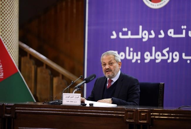 Afghanistan Health Minister Ferozuddin Feroz speaks with media during a news conference in Kabul, Afghanistan, Monday, Feb. 24, 2020. Afghanistan's Health Minister Ferozuddin Feroz says one of three persons suspected of having the coronavirus has tested positive in western Herat province bordering on Iran. (AP Photo)