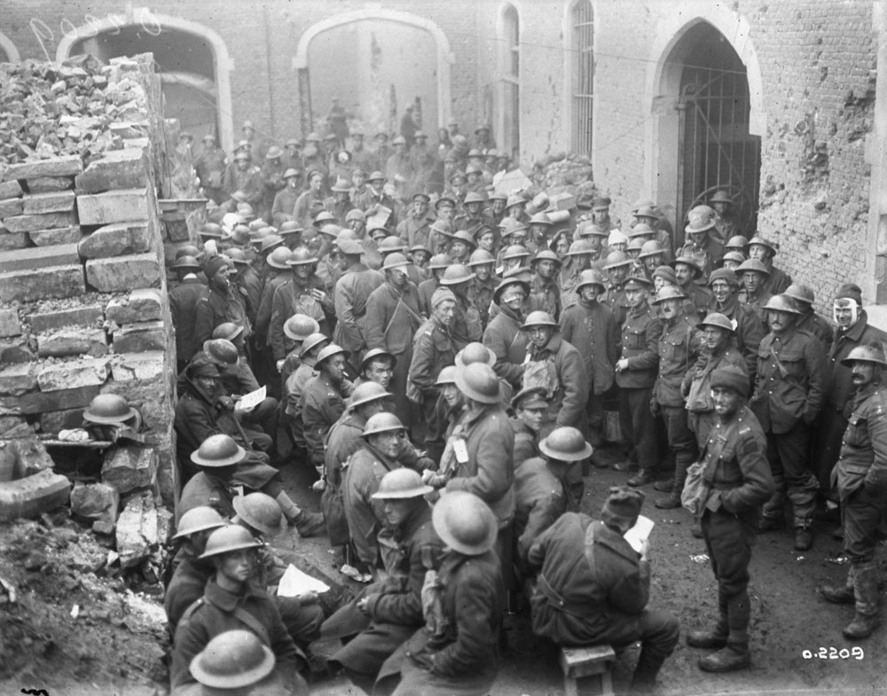 Library and Archives Canada
Wounded Canadians seen to at a dressing station during the Battle of Passchendaele in November 1917.