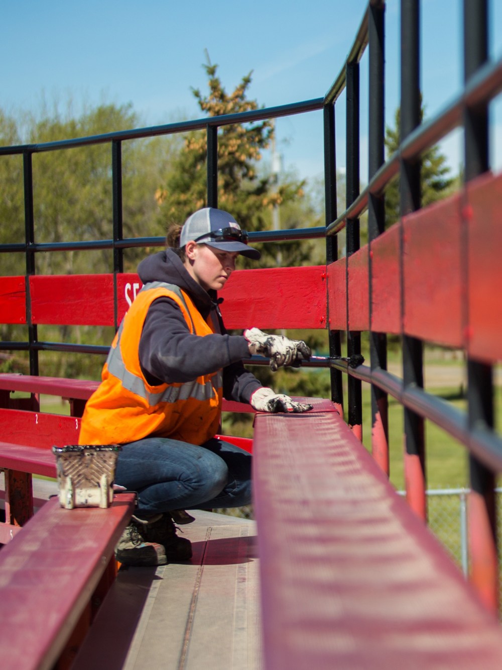 Chelsea Kemp/The Brandon Sun
Jill Gervais paints the stands of Andrews Field Friday in preparation for the Wheat City Whiskey Jacks Expedition League baseball home opener on May 28.