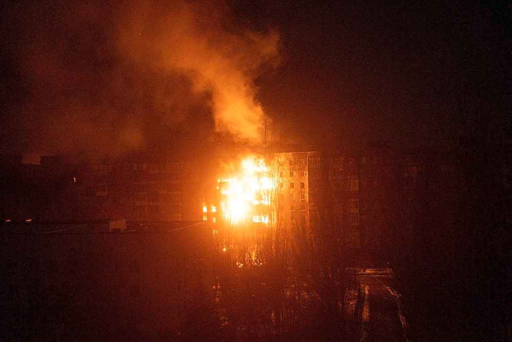 A fire burns at an apartment building after it was hit by shelling in Mariupol, Ukraine, Friday, March 11, 2022.(Mstyslav Chernov / The Associated Press)