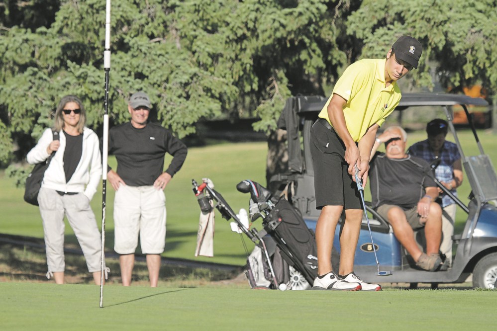 Thomas Friesen/The Brandon Sun Braxton Kuntz putst on the 18th hole during junior boys qualifying at the Tamarack golf tournament at Clear Lake Golf Course in August 2019. Although golf may return this year, tournaments may be limited in capacity to bring together large groups for banquets or as spectators on the course.