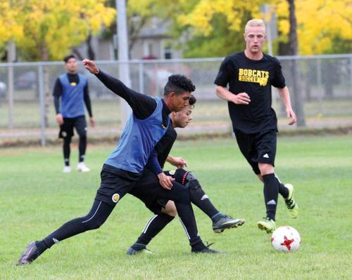 Matt Goerzen / The Brandon Sun
Diego Rodriguez, originally from Colombia, vies for the ball with a teammate during an afternoon practice session with the Brandon University Bobcats men's team.