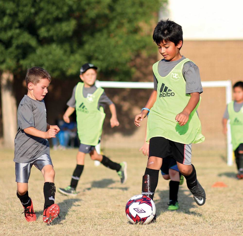 U7-8 Kids take part in the Westman Regional Soccer Association's summer programming at Meadows School on a warm evening.