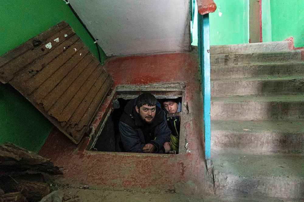 People hide in an improvised bomb shelter in Mariupol, Ukraine, Saturday, March 12, 2022.(Mstyslav Chernov / The Associated Press)