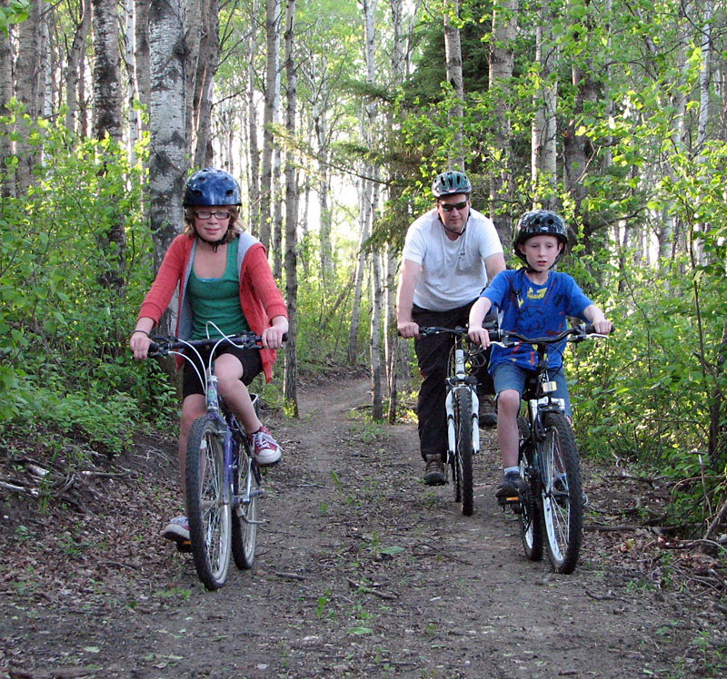Submitted
Three cyclists ride on the Onanole Trail, the village’s new recreation attraction. The trail, which is five kilometres in length, has been designed for both cyclists and walkers during the summer and skiers and snowshoers during the winter. Introductory walking and biking tours, that will start at the Rural Municipality of Park offices in Onanole, will be held on Saturday and Sunday.