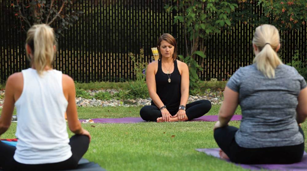 Jenn Shields conducts an outdoor mindfulness instruction.
