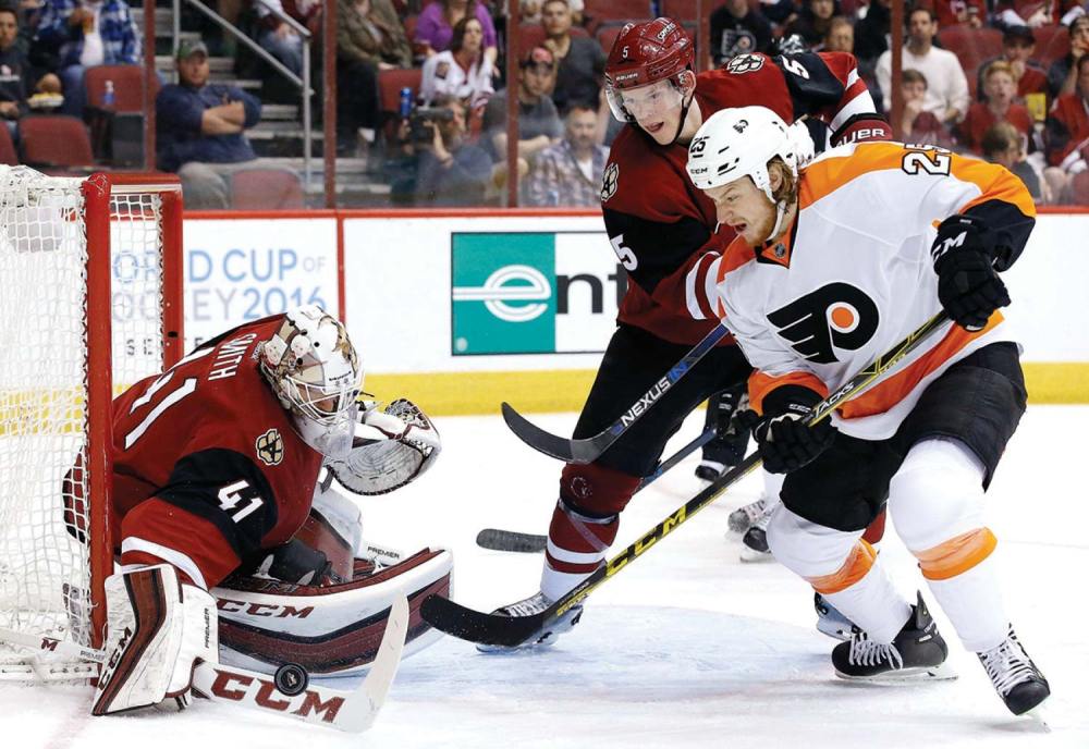Associated Press
Arizona Coyotes' Mike Smith (41) makes a save on a shot by Philadelphia Flyers' Ryan White (25) as Coyotes' Connor Murphy (5) defends during the second period of an NHL hockey game in 2016, in Glendale, Ariz. The Coyotes defeated the Flyers 2-1.