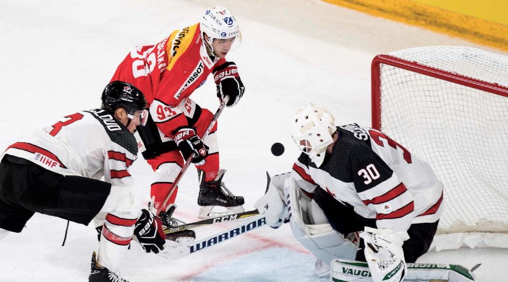 Assoicated Press
Switzerland's Lino Martschini, center, in action against Canada's Zach Whitecloud, left, and Canada's goaltender Ben Scrivens during the 2017 Karjala Cup ice hockey match between Switzerland and Canada in the Tissot Arena in Biel, Switzerland, in 2017.