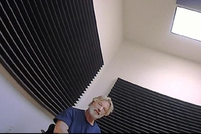 In this image from video released by the Santa Fe County Sheriff's Office, Alec Baldwin speaks with investigators following a fatal shooting last year on a movie set in Santa Fe, N.M. Data files released on Monday, April 25, 2022, included videos of investigators debriefing Baldwin on the day of the shooting inside a compact office. (Santa Fe County Sheriff's Office via AP)