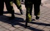 Master Corporal Jody Mitic walks, on his 'running legs' past a fellow soldier, as he prepares for a charity run in Toronto in this March 15, 2009 photo.&nbsp;Canada's auditor general has released a report on wait times for veterans to receive disability benefits.&nbsp;THE CANADIAN PRESS/Chris Young
