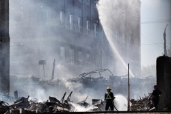 Matt Goerzen/The Brandon Sun
Firefighters continued to douse the smouldering remains of the Christie