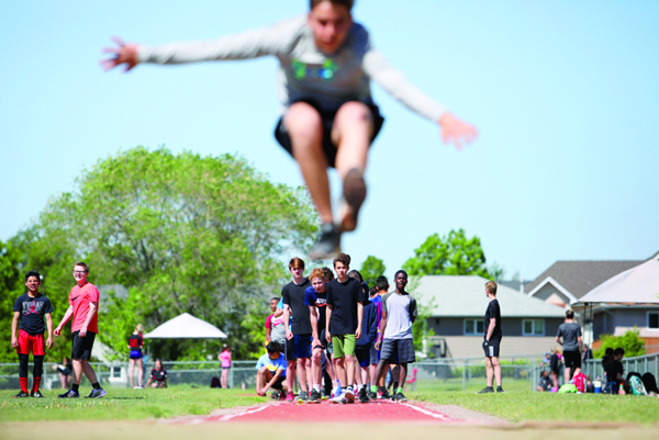12062019
Competitors take turns going for their longest jumps during the grade eight boys long jump event at the Brandon School Division Grade 7 & 8 City Track and Field Championship at UCT Stadium on Wednesday. 
(Tim Smith/The Brandon Sun)