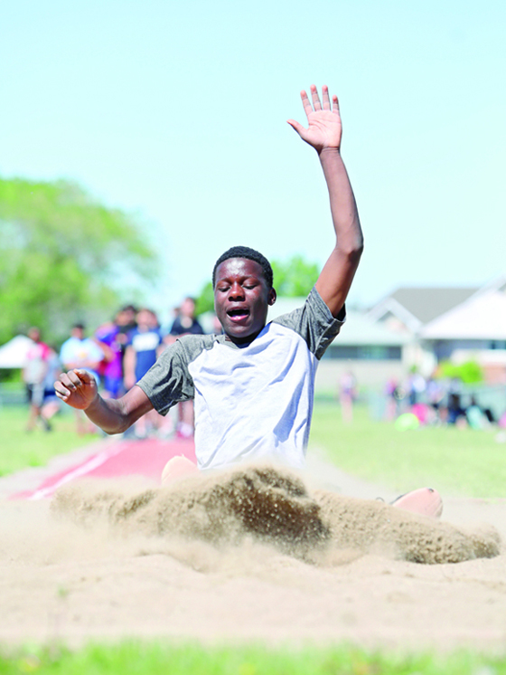 12062019
Femi Alebiose of Riverheights School kicks up sand on his landing during the grade eight boys long jump event at the Brandon School Division Grade 7 & 8 City Track and Field Championship at UCT Stadium on Wednesday. 
(Tim Smith/The Brandon Sun)