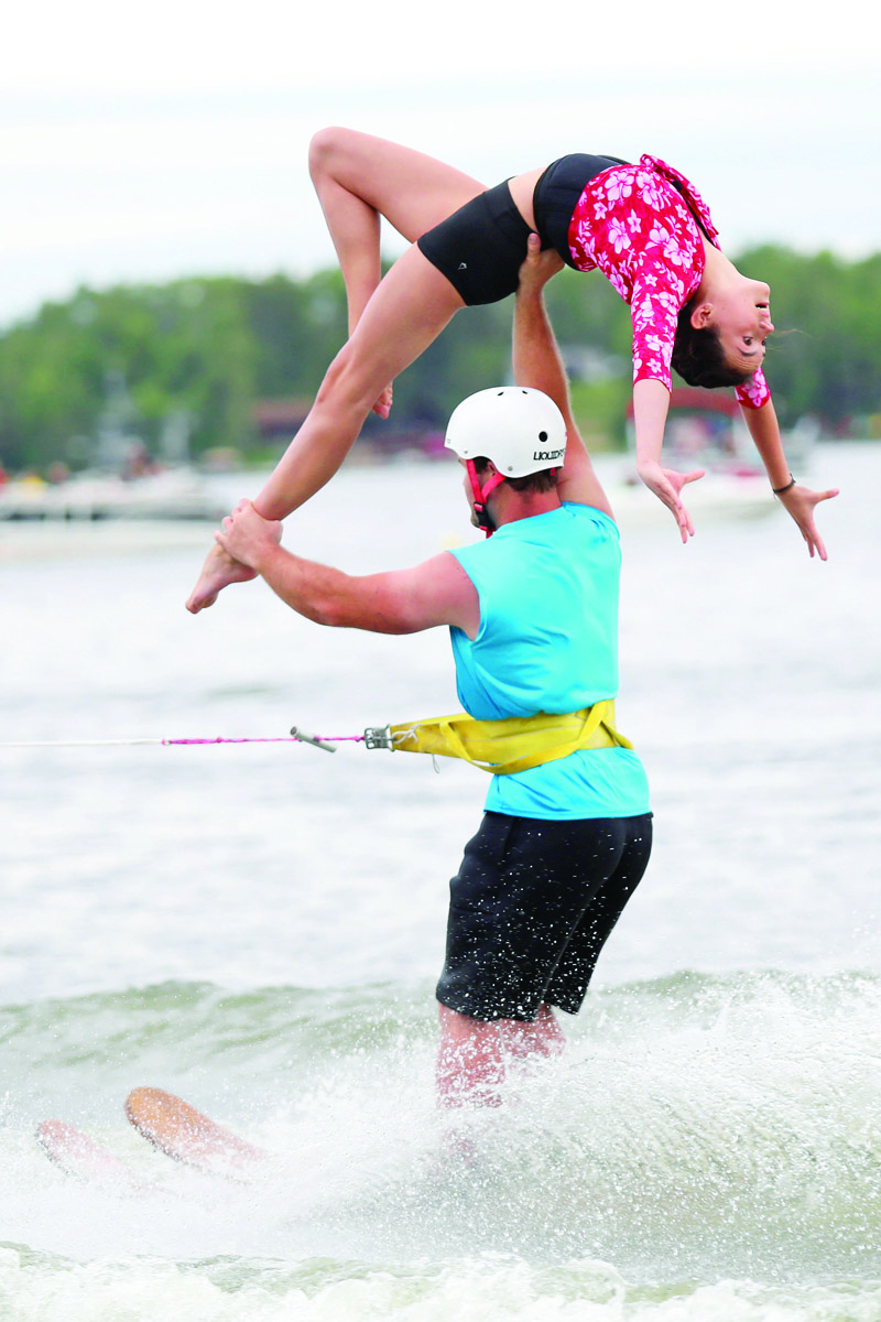 Kennedy Gray and Jamie Teetaert with the Club de Skinautique waterski team perform on the American side of Lake Metigoshe in North Dakota on Wednesday evening. The waterski club, in its 62nd season, is made up of both Canadian and American skiiers and performs a variety of shows throughout the summer. Cottagers and other visitors sit on the hill overlooking the lake where the show takes place or watch from boats out on the lake. Today is Independence Day in the United States and the holiday brings out large crowds to the show. Club de Skinautique performed their first show in 1958.