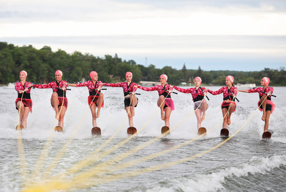 Members of the Club de Skinautique waterski team perform on the American side of Lake Metigoshe in North Dakota on Wednesday evening. The waterski club, in its 62nd season, is made up of both Canadian and American skiiers and performs a variety of shows throughout the summer. Cottagers and other visitors sit on the hill overlooking the lake where the show takes place or watch from boats out on the lake. Today is Independence Day in the United States and the holiday brings out large crowds to the show. Club de Skinautique performed their first show in 1958.