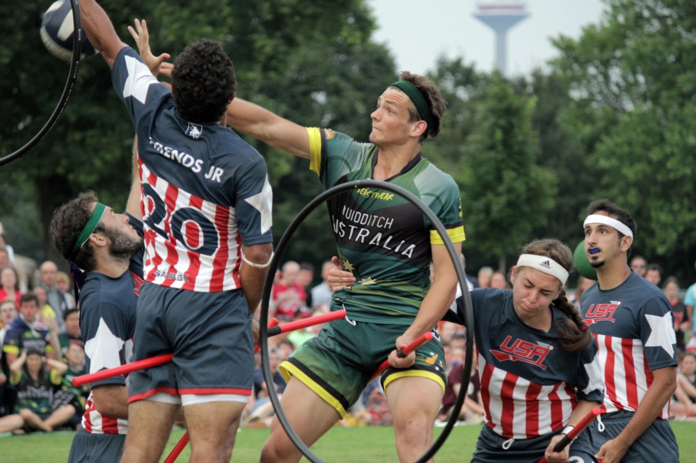 Andrew Nguyen
Team Australia keeper Callum Mayling forces his way through four players on Team USA to score a goal.