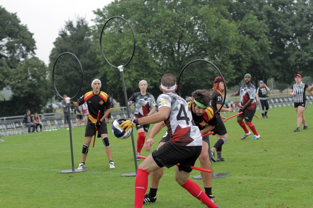 Andrew Nguyen
Team Canada chaser Devin Dutt (centre) is tackled near the hoops by Team Catalonia keeper Marc Garganté Oliva during pool play.