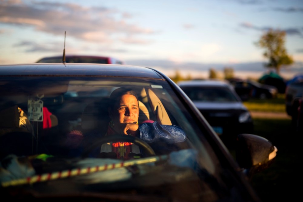 Tim Smith / Brandon Sun
Mark Bolin of Tulsa, Oklahoma watches the pow wow performances from his car at the 2016 Sioux Valley Dakota Nation Pow wow on Saturday evening. Bolin has been up to Canada for pow wow's before but this was his first time in Manitoba.