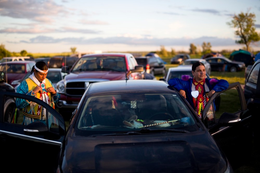 Tim Smith / Brandon Sun
Skush Brady of New Town, North Dakota gets ready to take part in a Specials event as friend Mark Bolin of Tulsa, Oklahoma watches the powwow at the Sioux Valley Dakota Nation powwow on Saturday evening. Sioux Valley Dakota Nation PowWow 2016