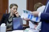Actor Amber Heard appears in the courtroom at the Fairfax County Circuit Court in Fairfax, Va., Wednesday, April 27, 2022. Actor Johnny Depp sued his ex-wife actress Amber Heard for libel in Fairfax County Circuit Court after she wrote an op-ed piece in The Washington Post in 2018 referring to herself as a 