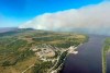 This June 10, 2022, aerial photo provided by the Bureau of Land Management Alaska Fire Service shows a tundra fire burning near the community of St. Mary's, Alaska. The largest documented wildfire burning through tundra in southwest Alaska was within miles St. Mary's and another nearby Alaska Native village, Pitkas Point, prompting officials Friday to urge residents to prepare for possible evacuation. (Ryan McPherson/Bureau of Land Management Alaska Fire Service via AP)