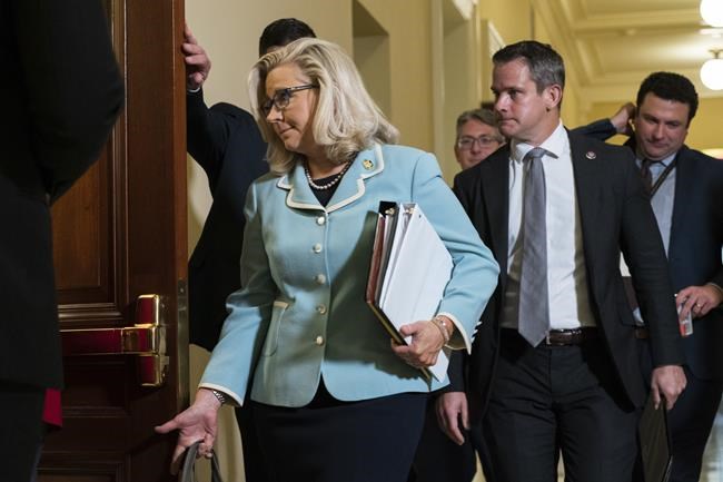 Rep. Liz Cheney, R-Wyo., followed by Rep. Adam Kinzinger, R-Ill., walk to the hearing room on Capitol Hill in Washington, Monday, June 13, 2022, for the public hearing of the House select committee investigating the Jan. 6 attack on the U.S. Capitol. (AP Photo/Manuel Balce Ceneta)