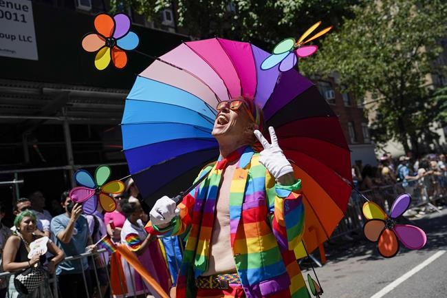 A reveler marches down Fifth Avenue during the annual NYC Pride March, Sunday, June 26, 2022, in New York. (AP Photo/Mary Altaffer)