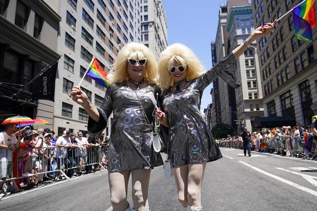 Revelers march down Fifth Avenue during the annual NYC Pride March, Sunday, June 26, 2022, in New York. (AP Photo/Mary Altaffer)