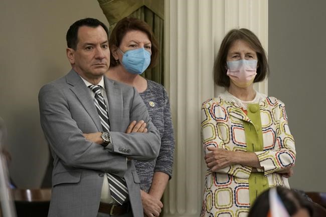 California Assembly Speaker Anthony Rendon, left, Senate President Pro Term Toni Atkins , center, and state Sen. Nancy Skinner, D-Berkeley, right, listens as members of the state Assembly speak on a a measure to put a constitutional amendment on the November ballot that would guarantee the right to an abortion and contraceptives at the Capitol in Sacramento, Calif., Monday, June 27, 2022. Lawmakers approved the bill, co-authored by Rendon and Atkins, that comes three days after the U.S. Supreme Court overruled Roe v. Wade. (AP Photo/Rich Pedroncelli)