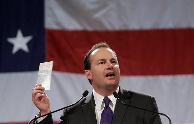 FILE - Sen. Mike Lee, R-Utah, addresses a crowd during a rally on April 25, 2014, in Sandy, Utah. Two well-funded challengers will attempt to unseat second-term Lee in Utah's Republican primary in a race that will test whether loyalty to former President Donald Trump remains a litmus test for Republican voters. Lee will appear on the ballot alongside former state lawmaker Becky Edwards and political operative Ally Isom on Tuesday, June 28, 2022. (AP Photo/Rick Bowmer, File)