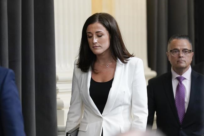 Cassidy Hutchinson, former aide to Trump White House chief of staff Mark Meadows, arrives to testify as the House select committee investigating the Jan. 6 attack on the U.S. Capitol holds a hearing at the Capitol in Washington, Tuesday, June 28, 2022. (AP Photo/J. Scott Applewhite)