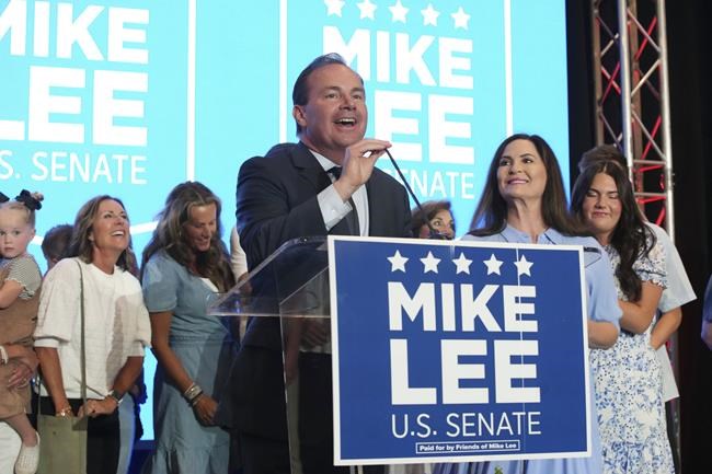 Sen. Mike Lee, R-Utah, and his wife, Sharon Lee, right front, talk to supporters during a Republican primary-night party Tuesday, June 28, 2022, in South Jordan, Utah. Utah defeated two challengers to win the Republican primary for the Senate seat. (AP Photo/George Frey)