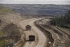 A heavy hauler trucks transports material from Suncor's North Steepbank Mine in the oilsands in Fort McMurray Alta, on Monday June 13, 2017. Oilsands companies are exploring the possibility of deploying small modular nuclear reactors to create the heat needed in oilsands mining. THE CANADIAN PRESS/Jason Franson