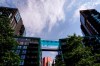 People swim in the elevated pool, called Sky Pool, in London, Monday, July 18, 2022. Britain's first-ever extreme heat warning is in effect for large parts of England as hot, dry weather that has scorched mainland Europe for the past week moves north, disrupting travel, health care and schools. (AP Photo/Alberto Pezzali)