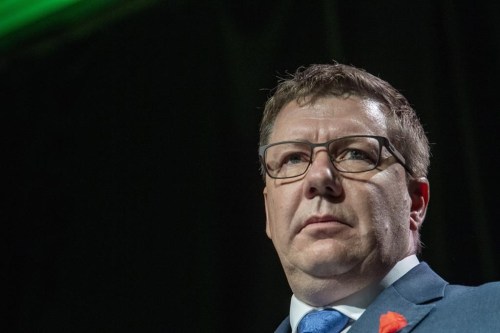 Saskatchewan Premier Scott Moe speaks during the Saskatchewan Party 2021 Convention in Saskatoon, Sask., Saturday, Nov. 6, 2021. A judge has issued a warrant for the arrest of a man accused of threatening the premier and the province''s chief medical health officer. THE CANADIAN PRESS/Liam Richards