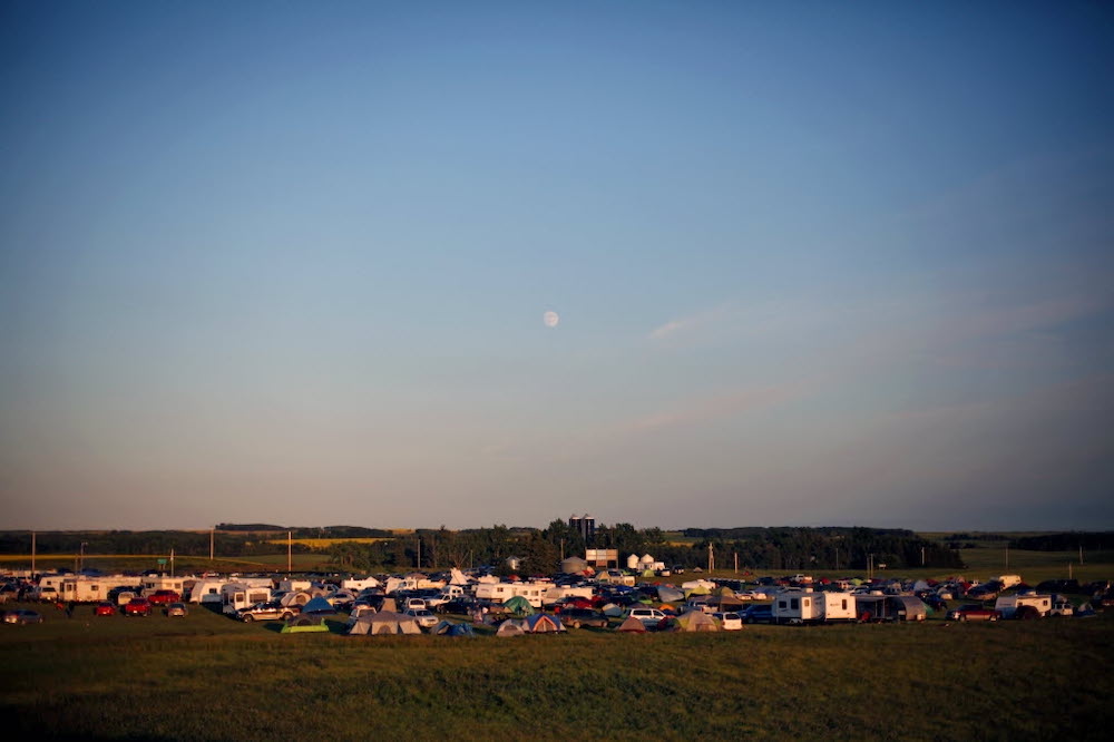 File
Rolling River First Nation at a powwow from several years ago under the light of the moon. The community is among 15 First Nations suing the federal government.