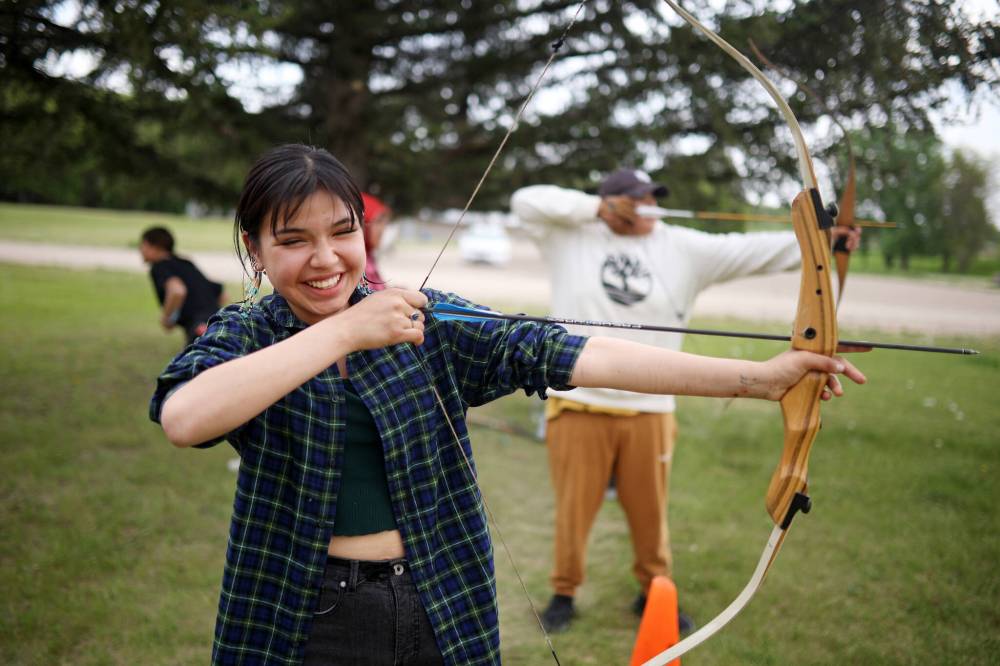 Tim Smith/The Brandon Sun
Ryleigh Hart reacts while practising her archery skills during Sioux Valley Dakota Nation’s culture camp at the Grand Valley Campground Thursday.
