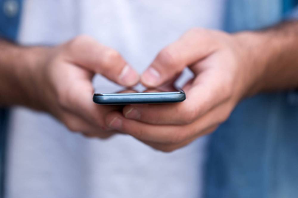 Jerald McNair says the prominent role texting has in the lives of youth hinders their language development. (Dreamstime/TNS)