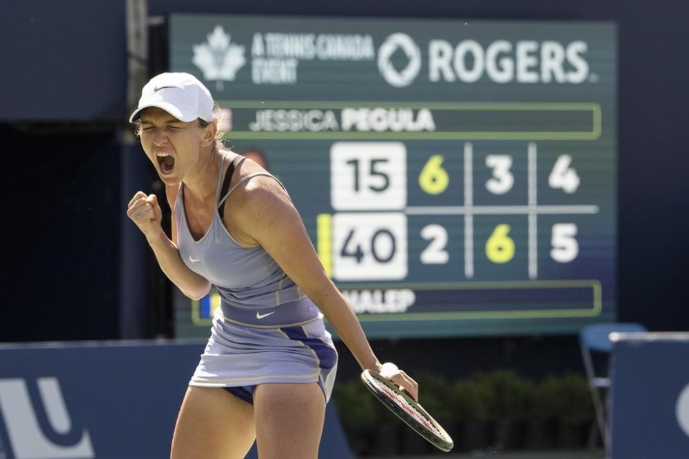 Romania's Simona Halep celebrates after beating United States' Jessica Pegula in Women's National Bank Open tennis semifinal action in Toronto on Saturday August 13, 2022. THE CANADIAN PRESS/Chris Young