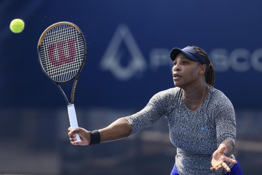 Serena Williams plays a return during a practice session ahead of the Western & Southern Open tennis tournament, Monday, Aug. 15, 2022, in Mason, Ohio. (AP Photo/Aaron Doster)
