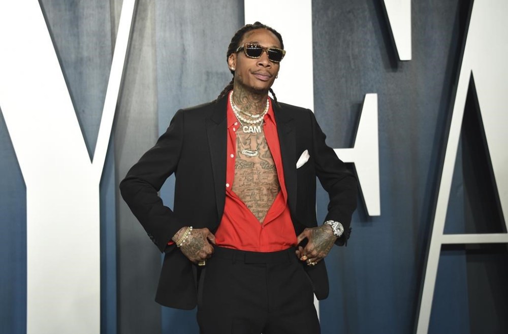 FILE - Wiz Khalifa arrives at the Vanity Fair Oscar Party on Sunday, Feb. 9, 2020, in Beverly Hills, Calif. Police say rapper Wiz Khalifa cut short a concert in suburban Indianapolis as people began fleeing the outdoor venue Friday night, Aug. 26, 2022, leaving three with minor injuries, following a disturbance. People started exiting the Ruoff Music Center in Noblesville about 10:30 p.m. after a reported disturbance on part of the amphitheater’s lawn (Photo by Evan Agostini/Invision/AP, File)